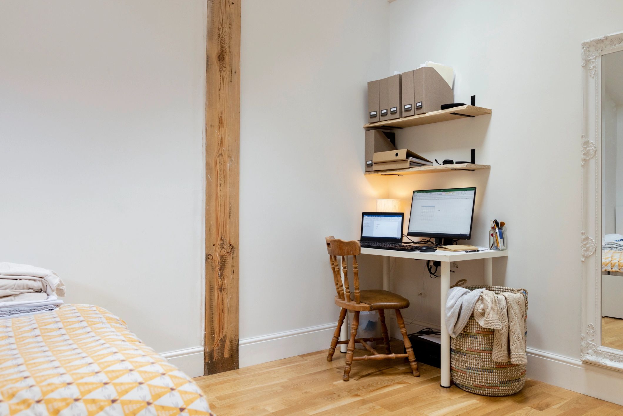 Organized publishing workspace with desk and shelves
